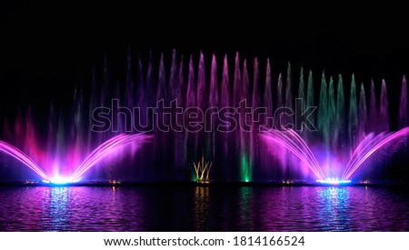 Musical fountain with laser animations. Fountain Roshen. Royalty-Free Stock Photo #1814166524