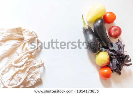 vegan grocery products and reusable bag on flat lay background. fresh healthy vegetables concept