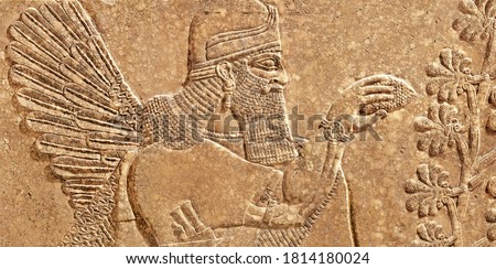 Sumerian wall relief, old carving panel from Middle East. Babylon culture and mythology. Artifact, Fine art of Ancient Babylonian and Assyrian civilization in Mesopotamia. History of Iraq and Iran. Royalty-Free Stock Photo #1814180024