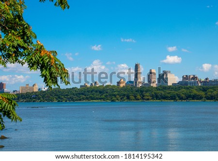 View of New York from the Hudson River walking path in Edgewater New Jersey. With a view of Grant's tomb and Riverside Church in New York,clear blue skies.   Royalty-Free Stock Photo #1814195342