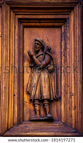 Wood engraving depicting the pilgrim on the church portal in Sansepolcro, Arezzo, Tuscany, Italy