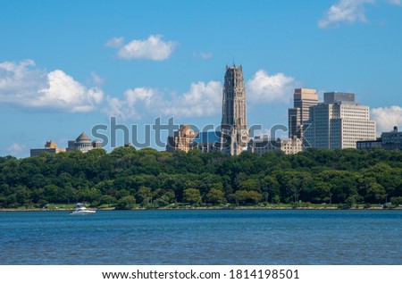 View of New York from the Hudson River walking path from New Jersey and a view of Grant's tomb and Riverside Church,with a boat on the river.   Royalty-Free Stock Photo #1814198501