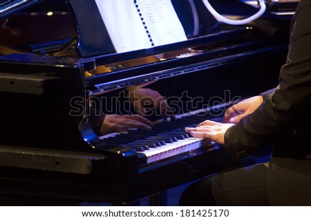 Pianist playing on piano