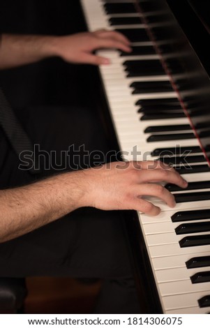 Piano Player Playing the Keys