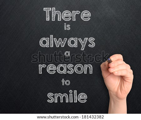 There is always a reason to smile handwritten on dark background