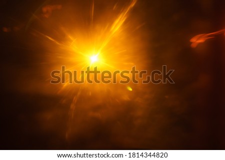 Abstract imitation sun starlight distant galaxy on a black background. -image