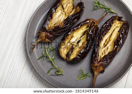 Aubergine - oven baked eggplant on plate Royalty-Free Stock Photo #1814349146