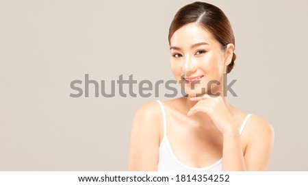 Asian women touching soft chin. skin close up.