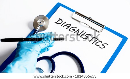 Paper with text DIAGNOSTICS on a table with stethoscope. Medical concept