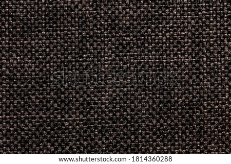 Black textile background with unique surface. High resolution photo.