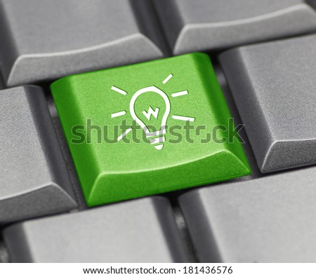 Computer key green - light bulb
