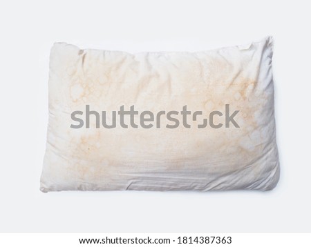 Close up dirty white pillow over white background. 
