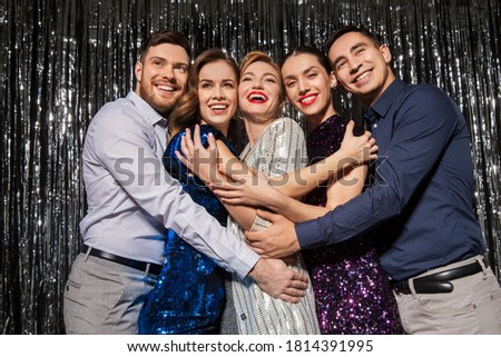 celebration, people and holiday style concept - happy friends in party clothes over black background