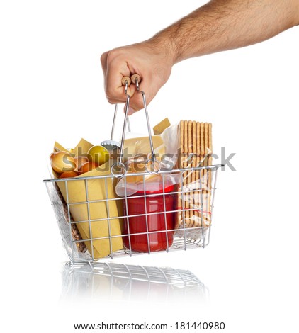 Man takes the shopping basket with various food on white
