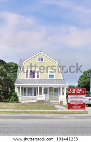 Real Estate For Sale Sign Suburban Gambrel style home residential neighborhood usa blue sky clouds