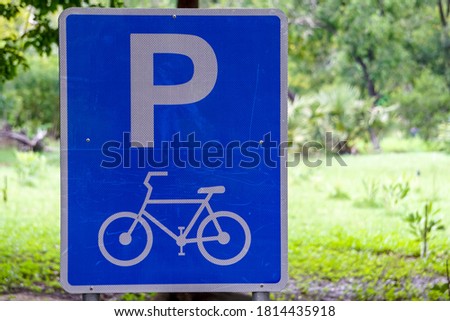 Bicycle parking sign in the park.
