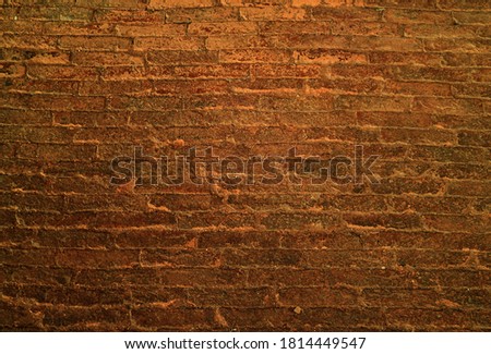 Dark golden brown grunge brick wall for background