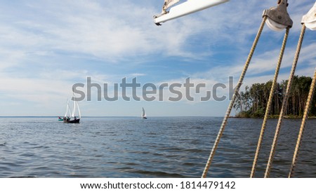 Sailing dinghies, sailing on yachts on water
