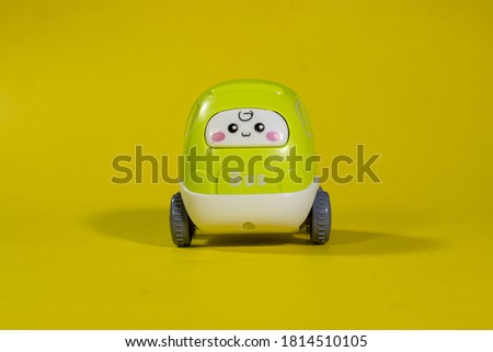 Kids vehicle toy with face on yellow background mini cute bus children toy