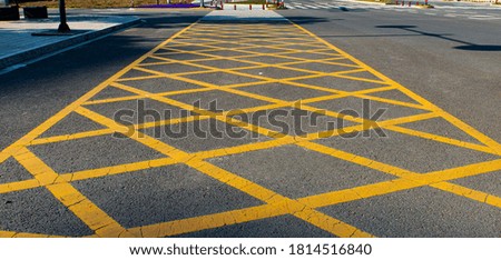 Yellow net pattern no parking traffic sign on highway