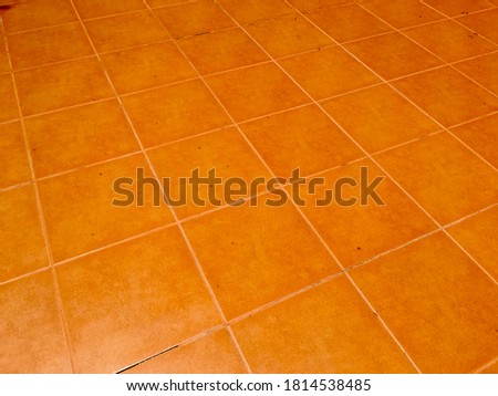 Orange ceramic tile floor texture pattern background 