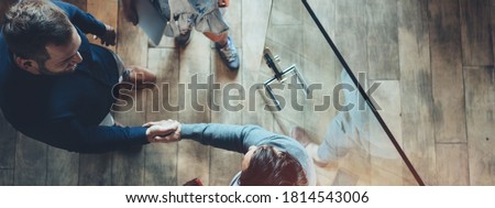 Business office concept. Successful meeting, handshake, top view. Wide screen, panoramic Royalty-Free Stock Photo #1814543006