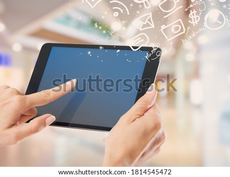 Hands touching blank tablet screen,