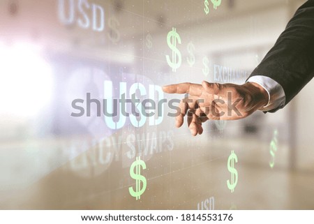 Man hand clicks on virtual USD symbols illustration on blurred office background. Trading and currency concept. Multiexposure