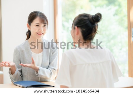 Meeting young asian women in the room. Consultant. Royalty-Free Stock Photo #1814565434