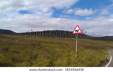 Sheep warning sign on scottish road