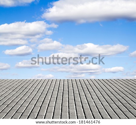paving stone floor with cloud and blue sky
