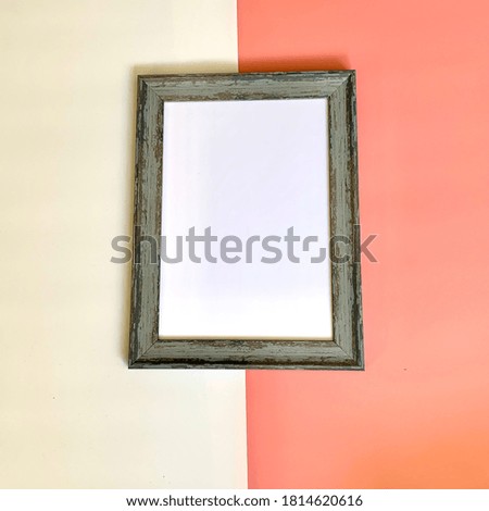 Old photo frame with big leaf