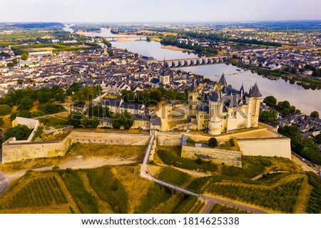 Fly over the picturesque town of Saumur and medieval castle Saumur. France Royalty-Free Stock Photo #1814625338