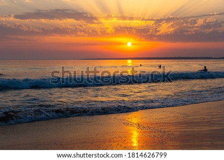 Image of summer sunny ocean waves and sunset in colorful tones
