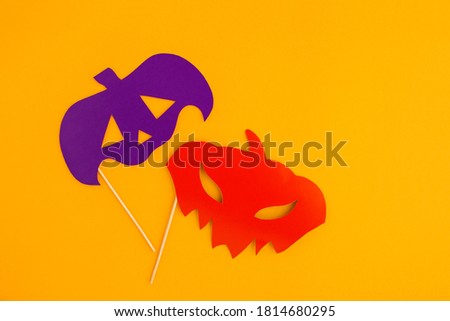 happy halloween paper eye masks with scary faces on orange background