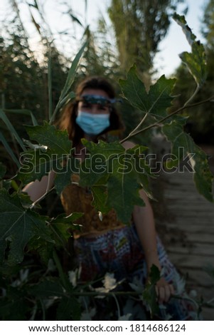 Woman looking at camera with face mask