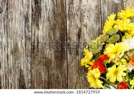 fall flowers on a rustic wood background