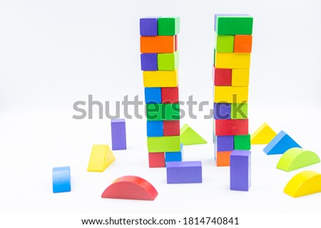 Untidy variety colorful blocks two tower same 9/11