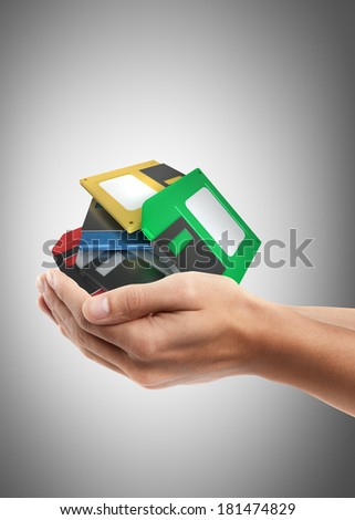 Man hand holding object ( floppy disks) High resolution 