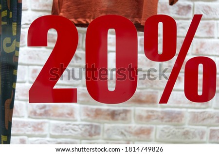 Store door discount sticker. holiday announcement of the sale in cloth shop. 20% sale