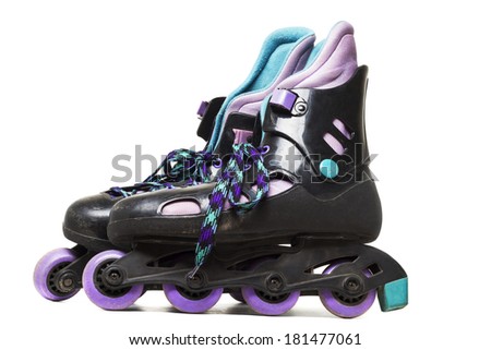 Close up view of inline skates isolated on a white background.