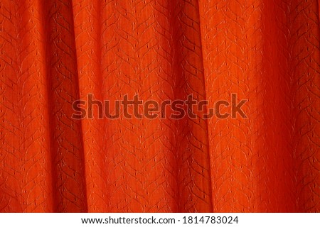 RED AND ORANGE CURTAIN CLOSED.