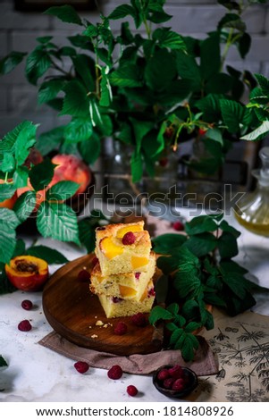 Peach raspberry olive oil cake.  rustic photo.selective focus