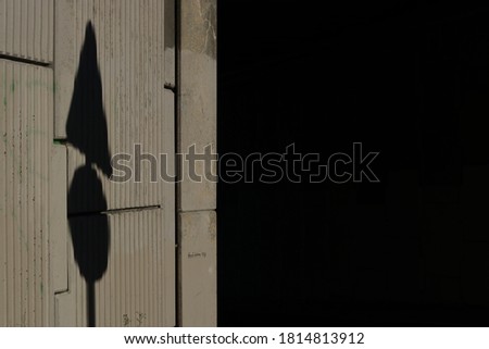 Shadow of a traffic signal on a wall