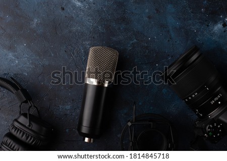Microphone for recording the voice isolated on dark blue background. Music concept.