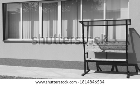 window and bench on the background of the wall, black and white photo minimalism