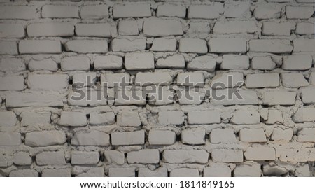 brick wall painted with white paint