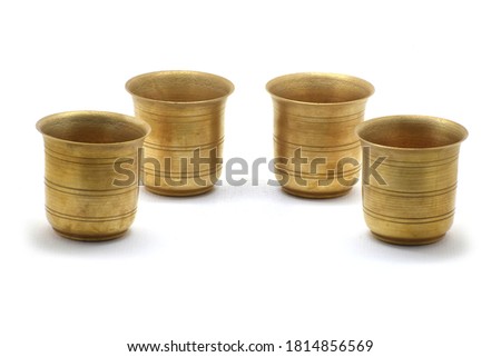 Brass Puja Glasses on white isolated background.