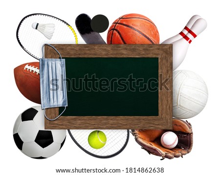 Framed chalkboard copy space with hanging medical face mask on top of sports balls and equipment on white background. Concept of sports during pandemic.