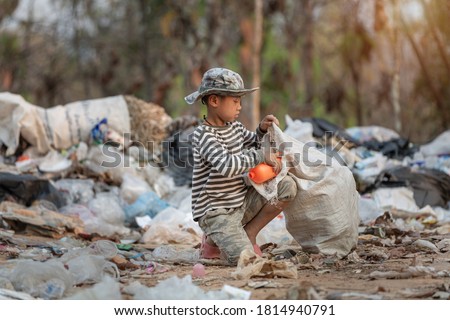 Child labor. Children are forced to work on rubbish. Poor children collect garbage. Poverty,  Violence children and trafficking concept,Anti-child labor, Rights Day on December 10. Royalty-Free Stock Photo #1814940791